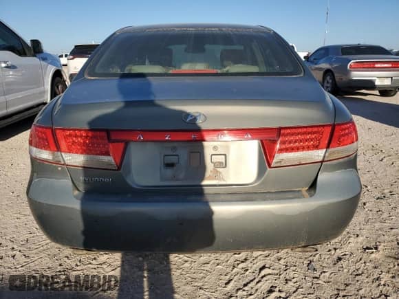 2007 Hyundai Azera SE с VIN KMHFC46F07A184036, выставлен на аукционе Copart как лот 79438334 с пробегом Не указан миль и Списание • Salvage title. История ставок и продаж доступна на DreamBid. Изображение 6.