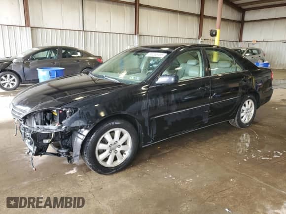 2004 Toyota Camry XLE z VIN 4T1BF30K94U074358, wystawiony jako Copart lot #86265155 z przebiegiem 185 924 mil mil oraz Szkoda całkowita • Salvage title. Historia ofert i sprzedaży dostępna na DreamBid. Obrazek 1.