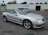 2005 Mercedes-Benz SL 500 with VIN WDBSK75F05F091086, listed as a Copart auction lot 84013865 with 119,950 mi miles and Salvage title. Bid and sale history available at DreamBid. Image 4.