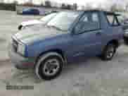 1999 Chevrolet Tracker z VIN 2CNBE18C4X6906275, wystawiony jako Copart lot #84539424 z przebiegiem 53 235 mil mil oraz Szkoda całkowita • Salvage title. Historia ofert i sprzedaży dostępna na DreamBid. Obrazek 1.