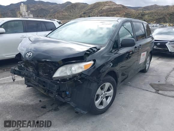 2014 Toyota Sienna L with VIN 5TDZK3DC3ES519412, listed as a IAAI auction lot 41732447 with Not provided miles and . Bid and sale history available at DreamBid. Image 2.