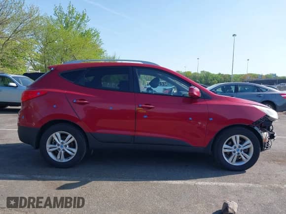 2011 Hyundai Tucson Limited with VIN KM8JUCAC4BU143656, listed as a IAAI auction lot 42144244 with 128,470 mi miles and . Bid and sale history available at DreamBid. Image 13.