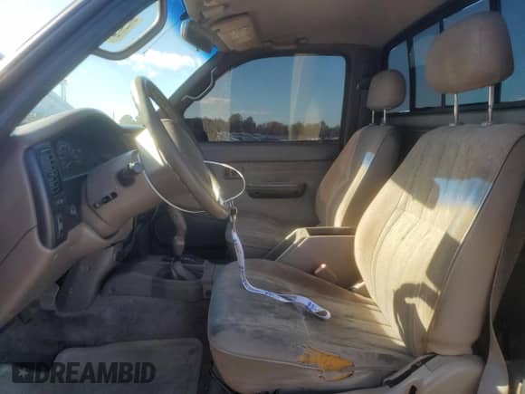 1999 Toyota Tacoma with VIN 4TAPM62N8XZ555830, listed as a Copart auction lot 82578465 with 175,853 mi miles and Salvage title. Bid and sale history available at DreamBid. Image 7.