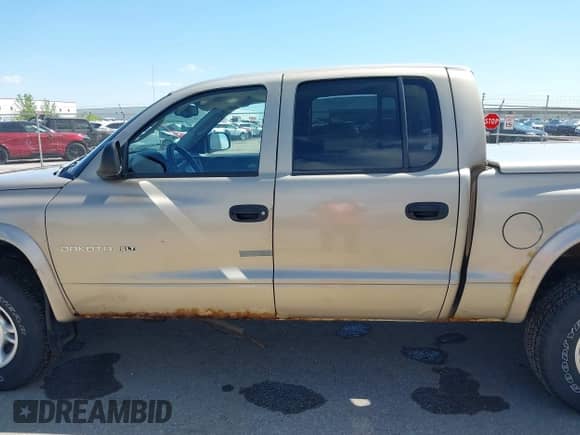 2002 Dodge Dakota SLT with VIN 1B7HG48N32S644931, listed as a IAAI auction lot 42320007 with 88,367 mi miles and . Bid and sale history available at DreamBid. Image 14.