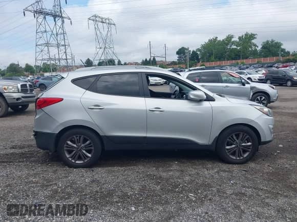 2014 Hyundai Tucson SE with VIN KM8JU3AG5EU831589, listed as a IAAI auction lot 42709097 with 147,199 mi miles and . Bid and sale history available at DreamBid. Image 14.