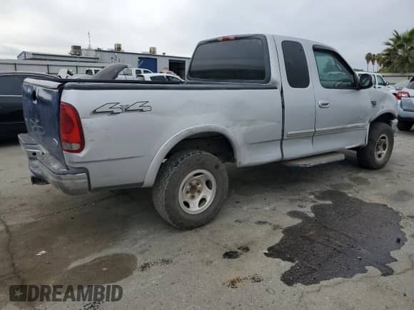 2000 Ford F-150 XL with VIN 1FTRX18W3YNB81000, listed as a Copart auction lot 86476645 with 210,299 mi miles and Salvage title. Bid and sale history available at DreamBid. Image 3.