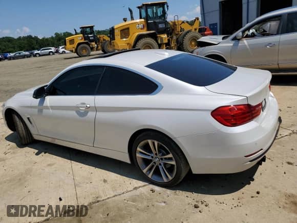 2016 BMW 4 Series 428i xDrive with VIN WBA3N9C56GK250493, listed as a Copart auction lot 63514855 with 166,061 mi miles and Salvage title. Bid and sale history available at DreamBid. Image 2.