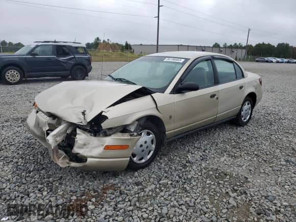 2000 Saturn SL with VIN 1G8ZH5283YZ221335, listed as a Copart auction lot 84196955 with 157,098 mi miles and Salvage title. Bid and sale history available at DreamBid. Image 1.