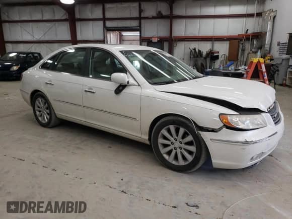 2009 Hyundai Azera GLS z VIN KMHFC46D09A353781, wystawiony jako Copart lot #62323855 z przebiegiem 169 064 mil mil oraz Szkoda całkowita • Salvage title. Historia ofert i sprzedaży dostępna na DreamBid. Obrazek 4.
