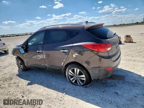 2014 Hyundai Tucson Limited with VIN KM8JU3AG7EU888134, listed as a Copart auction lot 70963915 with 125,059 mi miles and Salvage title. Bid and sale history available at DreamBid. Image 2.