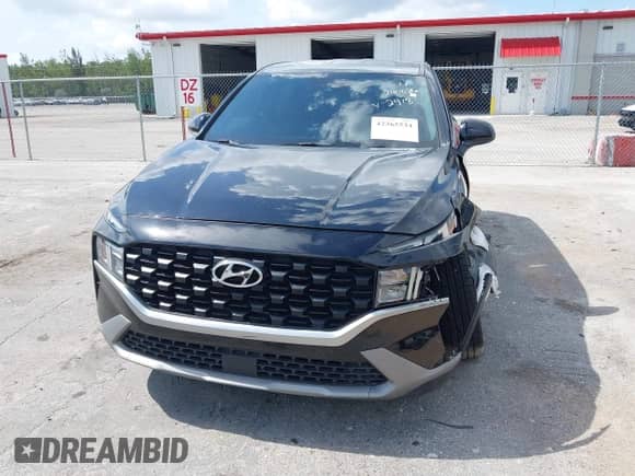 2021 Hyundai Santa Fe SE with VIN 5NMS14AJ0MH332918, listed as a IAAI auction lot 42365534 with 58,720 mi miles and . Bid and sale history available at DreamBid. Image 6.