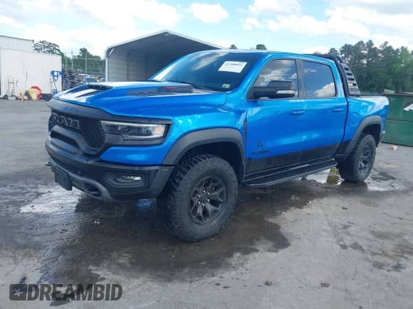2021 Ram 1500 TRX with VIN 1C6SRFU98MN804461, listed as a IAAI auction lot 42300032 with 28,735 mi miles and . Bid and sale history available at DreamBid. Image 2.