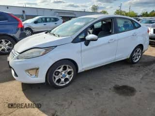 2012 Ford Fiesta SEL with VIN 3FADP4CJ2CM171333, listed as a Copart auction lot 71777635 with 117,504 mi miles and Salvage title. Bid and sale history available at DreamBid. Image 1.