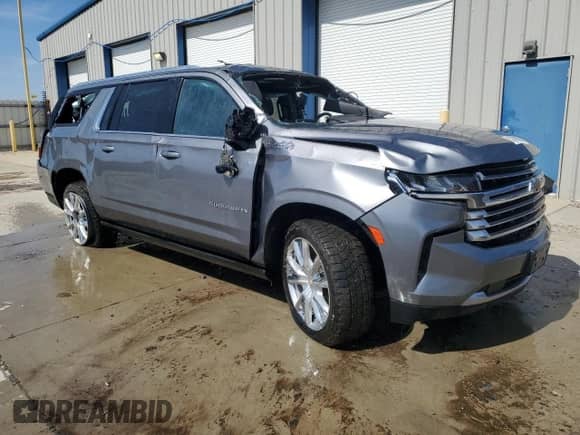 2022 Chevrolet Suburban High Country with VIN 1GNSKGKLXNR212370, listed as a Copart auction lot 50708835 with 114,646 mi miles and Salvage title. Bid and sale history available at DreamBid. Image 4.