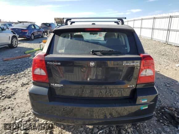 2010 Dodge Caliber SXT с VIN 1B3CB4HA1AD538956, выставлен на аукционе Copart как лот 77180114 с пробегом 116 337 миль миль и На запчасти • Non repairable. История ставок и продаж доступна на DreamBid. Изображение 6.