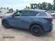 2025 Mazda CX-5 S Carbon Edition z VIN JM3KFBCM5S0702469, wystawiony jako IAAI lot #43076943 z przebiegiem 725 mil mil oraz . Historia ofert i sprzedaży dostępna na DreamBid. Obrazek 15.