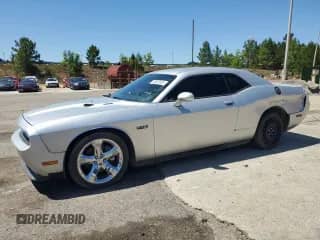 2012 Dodge Challenger R/T with VIN 2C3CDYBT0CH259731, listed as a Copart auction lot 58033035 with 142,427 mi miles and Clean title. Bid and sale history available at DreamBid. Image 1.