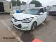 2013 Hyundai Veloster w/Black Int z VIN KMHTC6AD0DU155604, wystawiony jako IAAI lot #43314820 z przebiegiem 141 866 mil mil oraz . Historia ofert i sprzedaży dostępna na DreamBid. Obrazek 2.