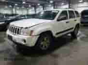 2006 Jeep Grand Cherokee Laredo with VIN 1J4GR48K76C255988, listed as a Copart auction lot 68521495 with 171,036 mi miles and Salvage title. Bid and sale history available at DreamBid. Image 1.