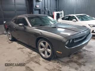 2013 Dodge Challenger SXT с VIN 2C3CDYAG5DH593050, выставлен на аукционе IAAI как лот 43392807 с пробегом 163 707 миль миль и . История ставок и продаж доступна на DreamBid. Изображение 1.