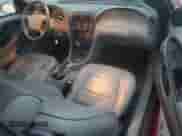 2004 Ford Mustang Deluxe z VIN 1FAFP44404F102515, wystawiony jako Copart lot #82361014 z przebiegiem 65 383 mil mil oraz Szkoda całkowita • Salvage title. Historia ofert i sprzedaży dostępna na DreamBid. Obrazek 8.