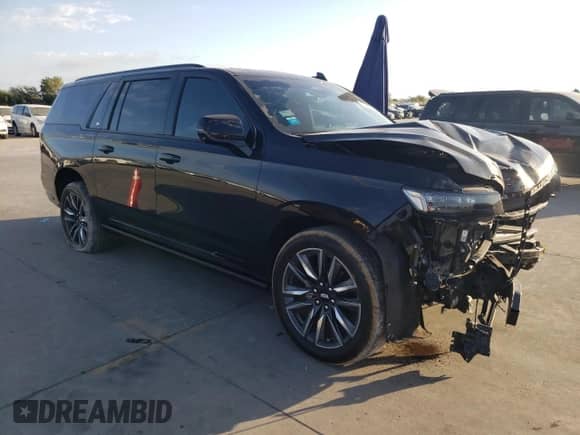 2024 Cadillac Escalade with VIN 1GYS4PKT3RR207675, listed as a Copart auction lot 77889674 with 34,951 mi miles and Salvage title. Bid and sale history available at DreamBid. Image 4.