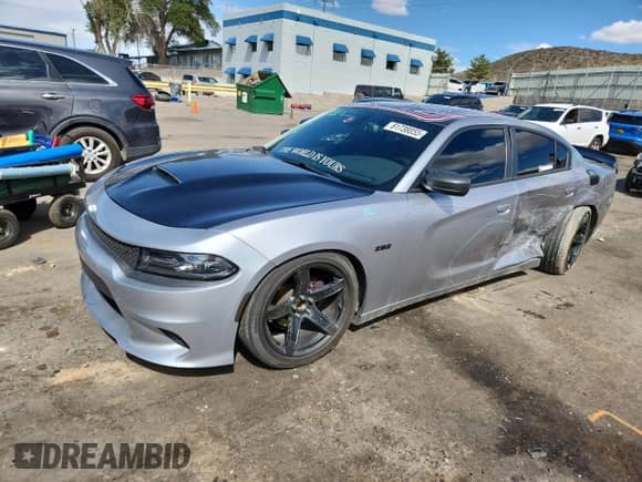 2016 Dodge Charger SXT with VIN 2C3CDXHGXGH317595, listed as a Copart auction lot 81738855 with 128,467 mi miles and Salvage title. Bid and sale history available at DreamBid. Image 1.