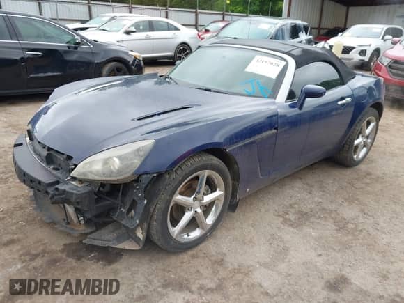 2009 Saturn Sky Red Line with VIN 1G8MT35X09Y105064, listed as a IAAI auction lot 42197028 with 106,673 mi miles and . Bid and sale history available at DreamBid. Image 2.