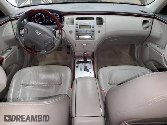 2007 Hyundai Azera SE с VIN KMHFC46F57A190303, выставлен на аукционе Copart как лот 87173494 с пробегом 121 463 миль миль и Списание • Salvage title. История ставок и продаж доступна на DreamBid. Изображение 8.