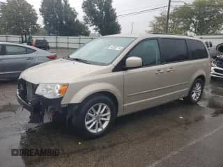 2013 Dodge Grand Caravan SXT with VIN 2C4RDGCG2DR741033, listed as a Copart auction lot 82282715 with 88,444 mi miles and Salvage title. Bid and sale history available at DreamBid. Image 1.