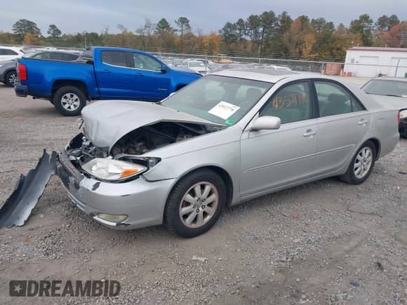 2003 Toyota Camry XLE z VIN 4T1BE30K53U680290, wystawiony jako IAAI lot #43527770 z przebiegiem 176 975 mil mil oraz . Historia ofert i sprzedaży dostępna na DreamBid. Obrazek 2.