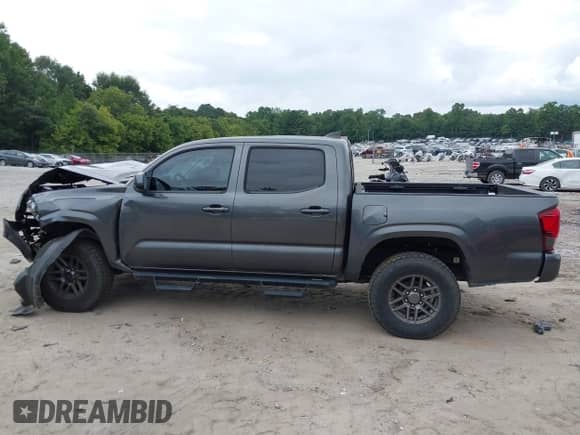 2020 Toyota Tacoma SR with VIN 3TMCZ5AN4LM314973, listed as a IAAI auction lot 42955800 with 94,693 mi miles and . Bid and sale history available at DreamBid. Image 14.