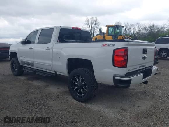 2016 Chevrolet Silverado 1500 LT with VIN 3GCUKREC0GG363536, listed as a IAAI auction lot 42064592 with 99,881 mi miles and . Bid and sale history available at DreamBid. Image 3.