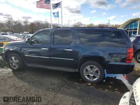2009 Chevrolet Suburban LTZ z VIN 1GNFK36309R243475, wystawiony jako Copart lot #90379995 z przebiegiem 168 390 mil mil oraz Szkoda całkowita • Salvage title. Historia ofert i sprzedaży dostępna na DreamBid. Obrazek 2.