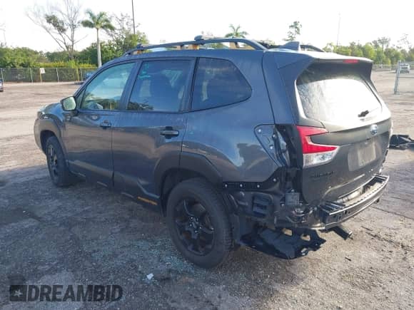 2022 Subaru Forester Wilderness with VIN JF2SKAMC4NH423882, listed as a IAAI auction lot 43272111 with 77,225 mi miles and . Bid and sale history available at DreamBid. Image 3.