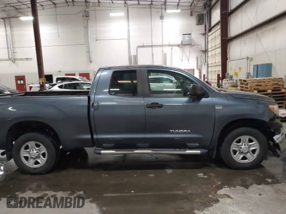 2008 Toyota Tundra z VIN 5TFRT54198X023567, wystawiony jako IAAI lot #43289726 z przebiegiem 185 308 mil mil oraz . Historia ofert i sprzedaży dostępna na DreamBid. Obrazek 13.