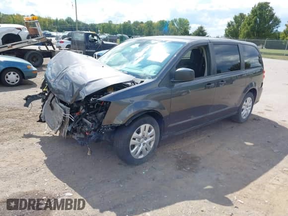 2019 Dodge Grand Caravan SE with VIN 2C4RDGBGXKR649411, listed as a IAAI auction lot 43135298 with 81,019 mi miles and . Bid and sale history available at DreamBid. Image 2.