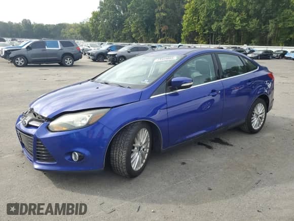 2014 Ford Focus Titanium with VIN 1FADP3J29EL338636, listed as a Copart auction lot 71959865 with 122,747 mi miles and Salvage title. Bid and sale history available at DreamBid. Image 1.
