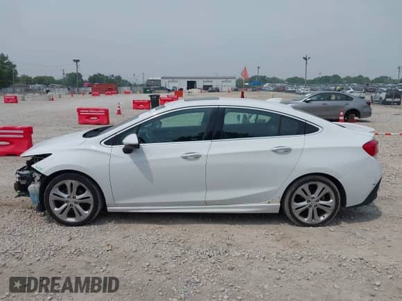 2016 Chevrolet Cruze Premier z VIN 1G1BG5SM0G7314436, wystawiony jako IAAI lot #42497584 z przebiegiem 124 980 mil mil oraz . Historia ofert i sprzedaży dostępna na DreamBid. Obrazek 15.