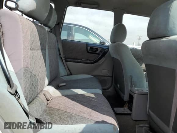 1999 Subaru Forester L with VIN JF1SF6353XH727555, listed as a Copart auction lot 80185275 with 186,950 mi miles and Salvage title. Bid and sale history available at DreamBid. Image 11.