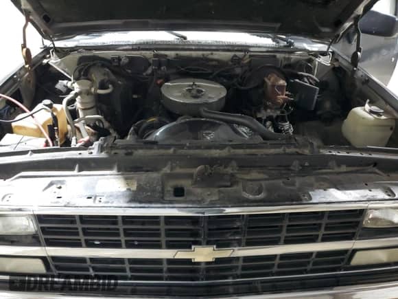 1990 Chevrolet Suburban z VIN 1GNGV26K0LF136318, wystawiony jako Copart lot #87379974 z przebiegiem 99 730 mil mil oraz Czysty tytuł • Clean title. Historia ofert i sprzedaży dostępna na DreamBid. Obrazek 11.