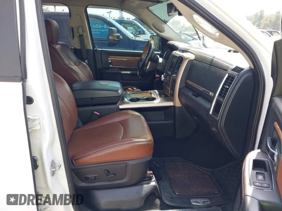 2015 Ram 1500 Laramie Longhorn with VIN 1C6RR7PT3FS728521, listed as a IAAI auction lot 42804961 with 119,644 mi miles and . Bid and sale history available at DreamBid. Image 5.