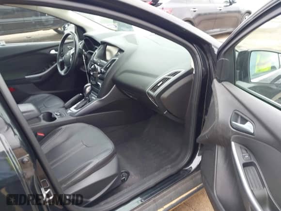 2014 Ford Focus Titanium with VIN 1FADP3N2XEL451800, listed as a IAAI auction lot 43103609 with 215,961 mi miles and . Bid and sale history available at DreamBid. Image 5.