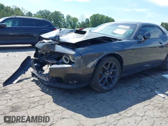 2023 Dodge Challenger SXT with VIN 2C3CDZAG1PH654517, listed as a IAAI auction lot 42600570 with 34,214 mi miles and . Bid and sale history available at DreamBid. Image 2.