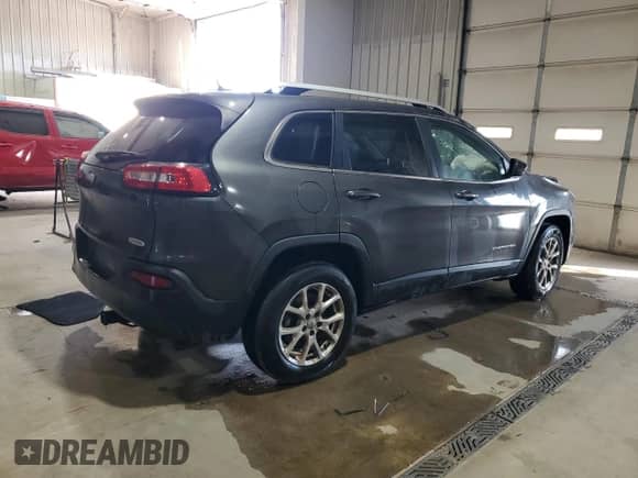 2014 Jeep Cherokee Latitude with VIN 1C4PJMCB2EW297843, listed as a Copart auction lot 85495155 with 175,788 mi miles and Salvage title. Bid and sale history available at DreamBid. Image 3.