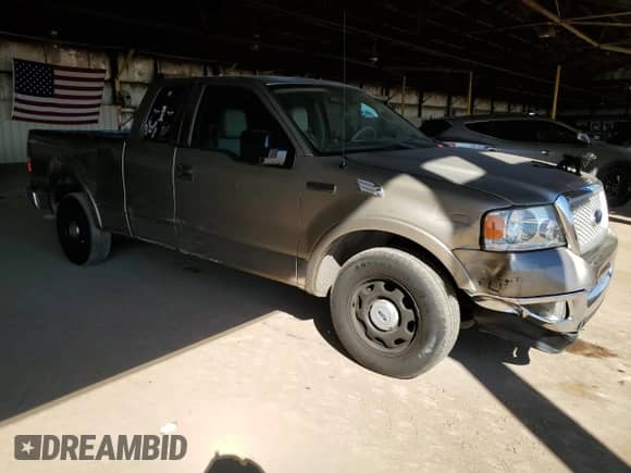 2004 Ford F-150 XL with VIN 1FTPX12594NB86753, listed as a Copart auction lot 82329625 with 195,527 mi miles and Salvage title. Bid and sale history available at DreamBid. Image 4.