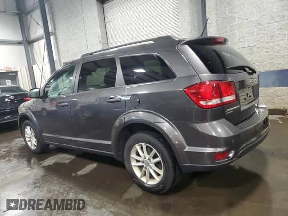 2017 Dodge Journey SXT with VIN 3C4PDDBG1HT561018, listed as a Copart auction lot 69006095 with 136,612 mi miles and Salvage title. Bid and sale history available at DreamBid. Image 2.