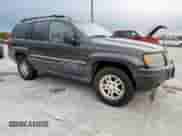 2004 Jeep Grand Cherokee Laredo with VIN 1J4GW48S84C361744, listed as a Copart auction lot 91091115 with 236,095 mi miles and Clean title. Bid and sale history available at DreamBid. Image 4.