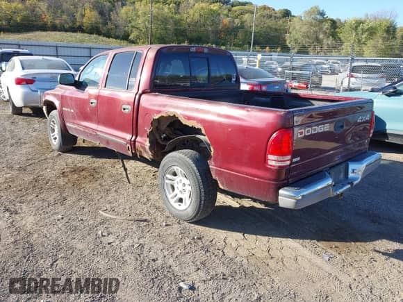 2002 Dodge Dakota SLT with VIN 1B7HG48N82S552357, listed as a IAAI auction lot 43498260 with 192,220 mi miles and . Bid and sale history available at DreamBid. Image 3.