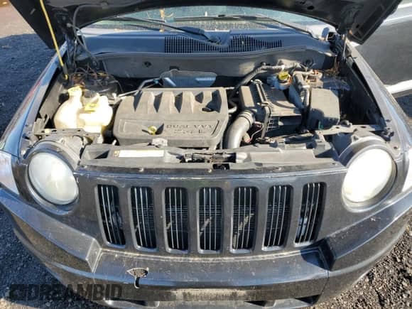2010 Jeep Compass Sport z VIN 1J4NT1FB3AD641479, wystawiony jako Copart lot #79859594 z przebiegiem 173 768 mil mil oraz Szkoda całkowita • Salvage title. Historia ofert i sprzedaży dostępna na DreamBid. Obrazek 12.